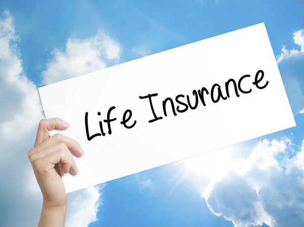 Life Insurance Sign on white paper. Man Hand Holding Paper with