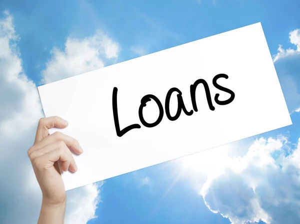 Loans  Sign on white paper. Man Hand Holding Paper with text. Is