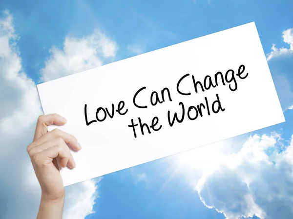 Love Can Change the World Sign on white paper. Man Hand Holding