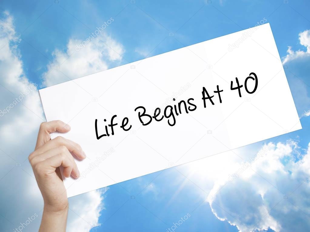 Life Begins At 40  Sign on white paper. Man Hand Holding Paper w