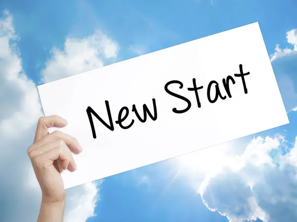 New Start Sign on white paper. Man Hand Holding Paper with text. — Stock Photo, Image