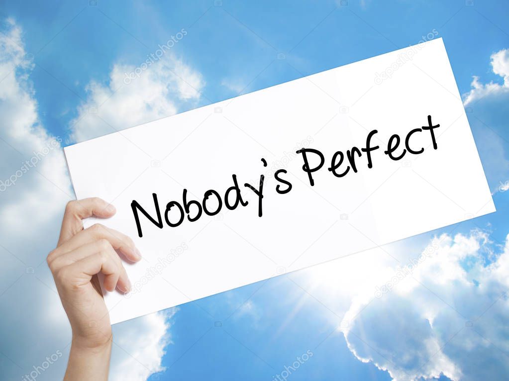 Nobodys Perfect Sign on white paper. Man Hand Holding Paper with