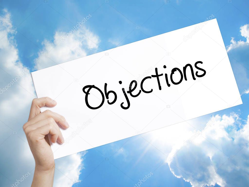 Objections  Sign on white paper. Man Hand Holding Paper with tex