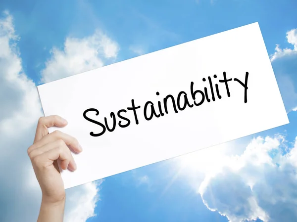 Sustainability  Sign on white paper. Man Hand Holding Paper with — Stock Photo, Image