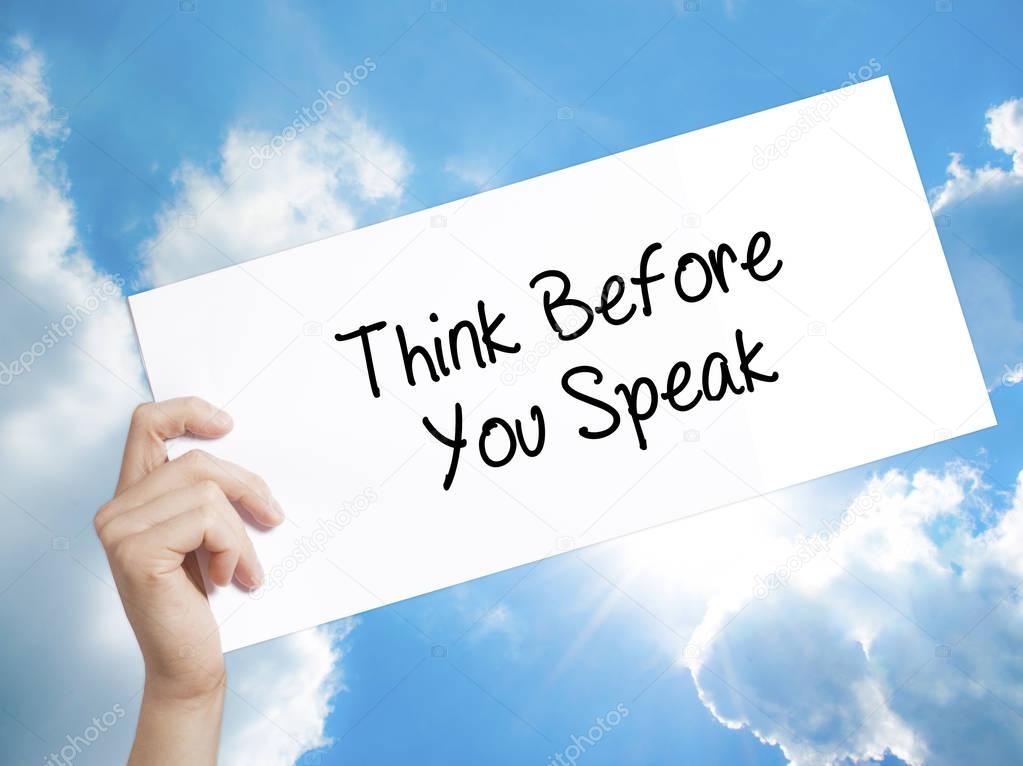 Think Before You Speak Sign on white paper. Man Hand Holding Pap
