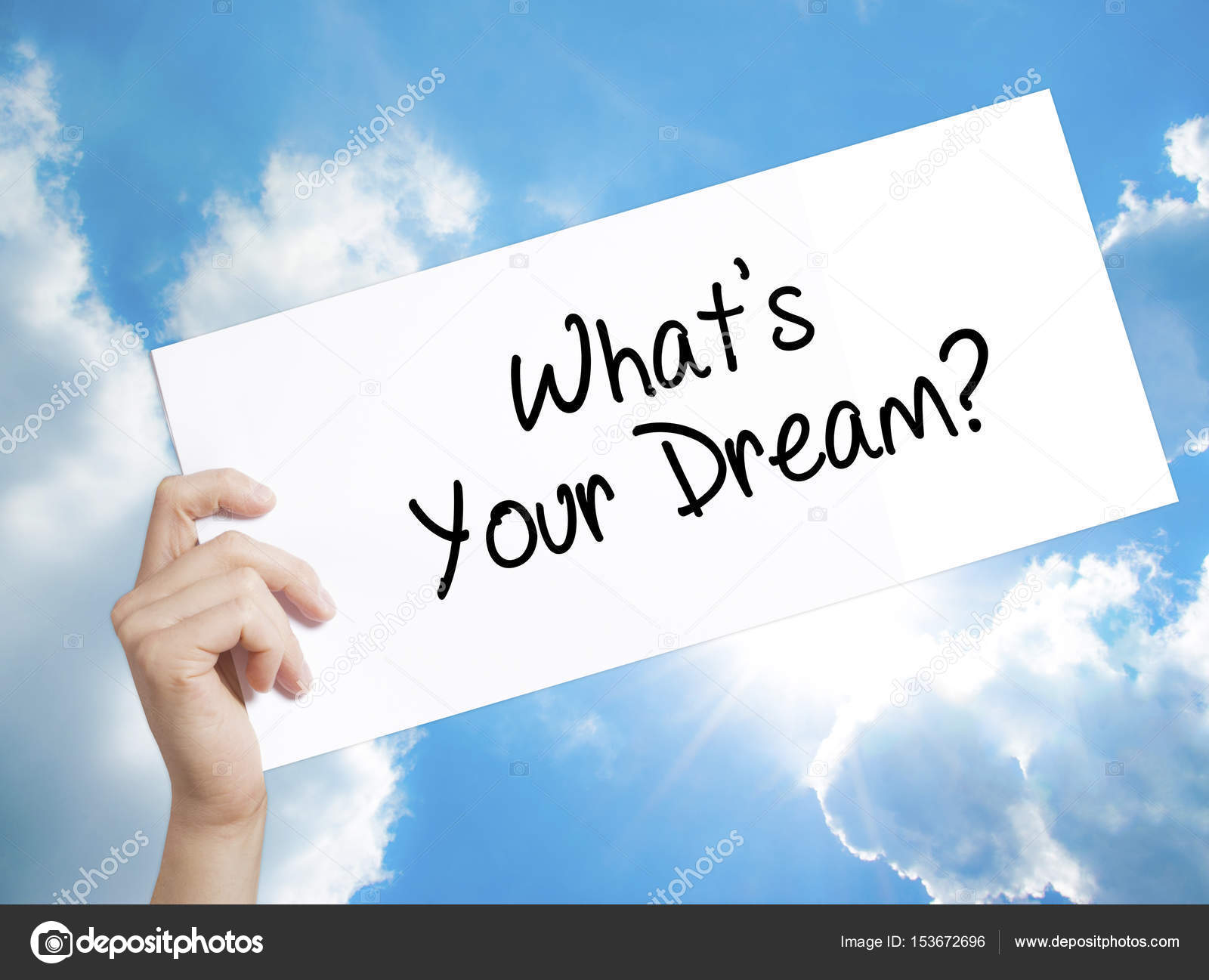 What's Your Dream? Sign on white paper. Man Hand Holding Paper w