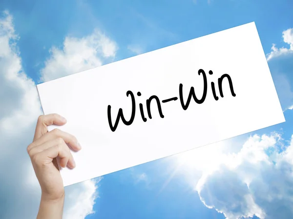 Win-Win  Sign on white paper. Man Hand Holding Paper with text. — Stock Photo, Image