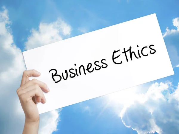 Business Ethics Sign on white paper. Man Hand Holding Paper with — Stock Photo, Image