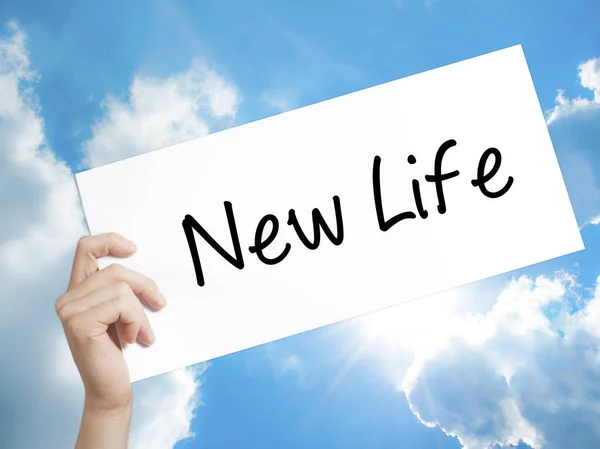New Life Sign on white paper. Man Hand Holding Paper with text. — Stock Photo, Image