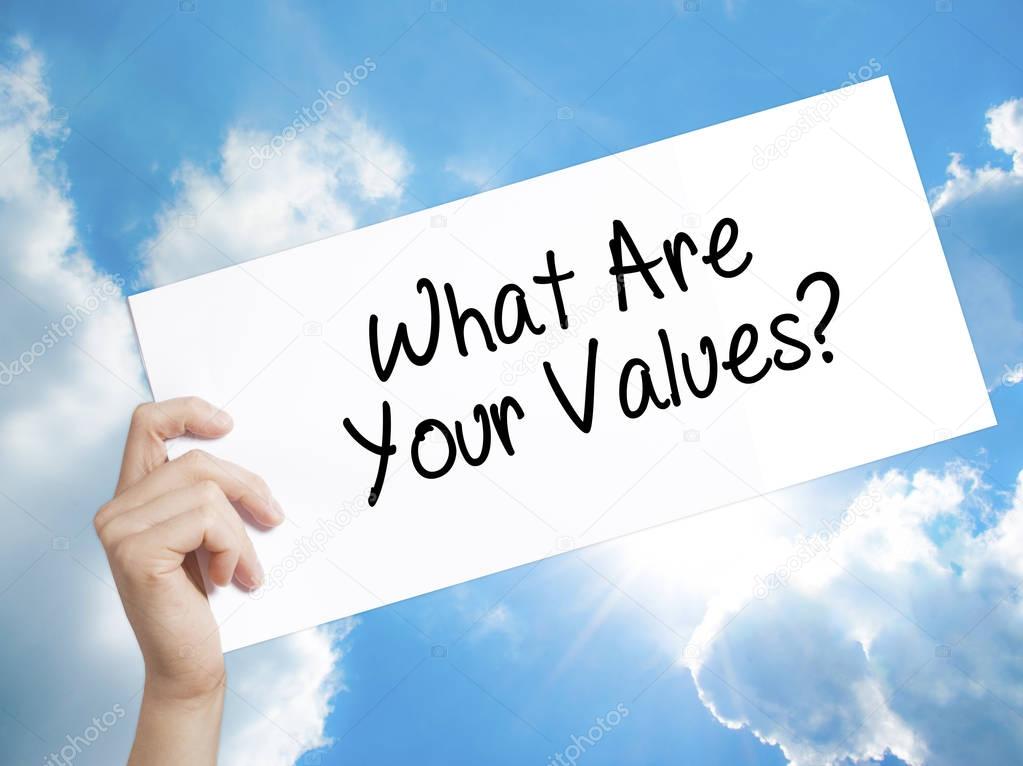 What Are Your Values? Sign on white paper. Man Hand Holding Pape