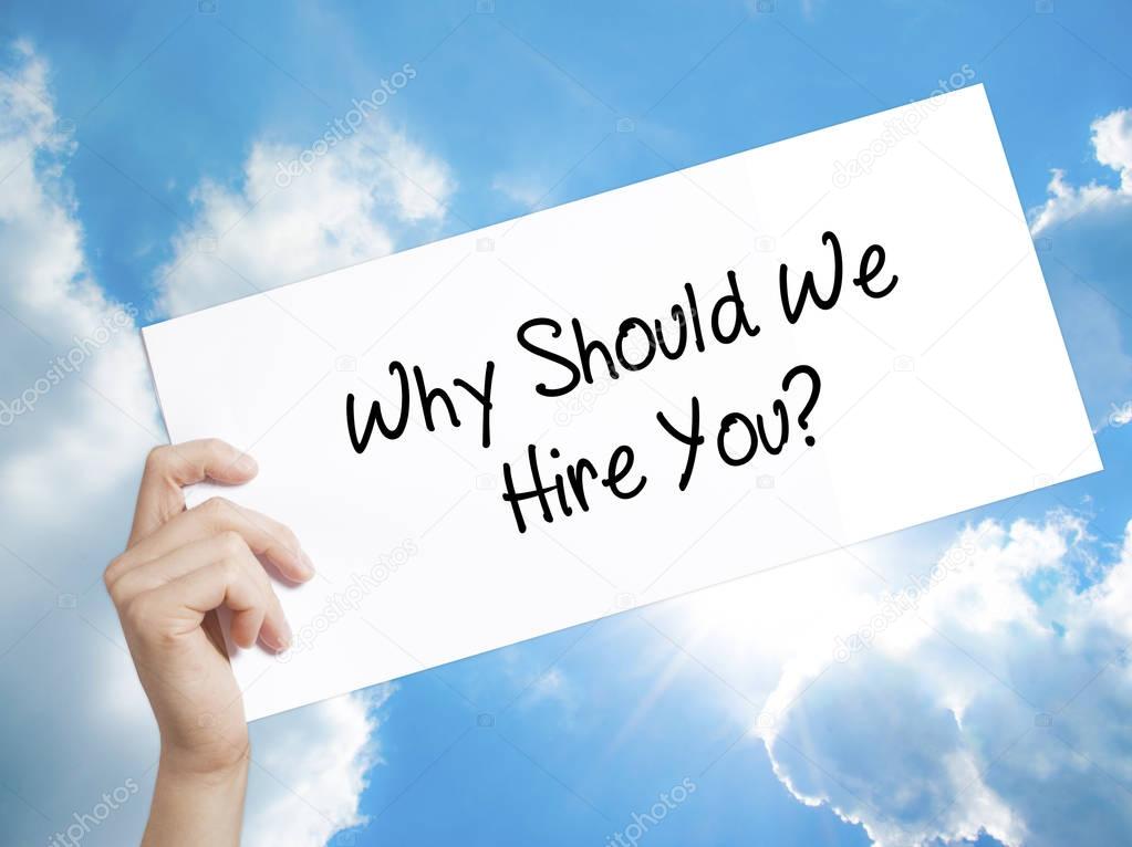 Why Should We Hire You? Sign on white paper. Man Hand Holding Pa