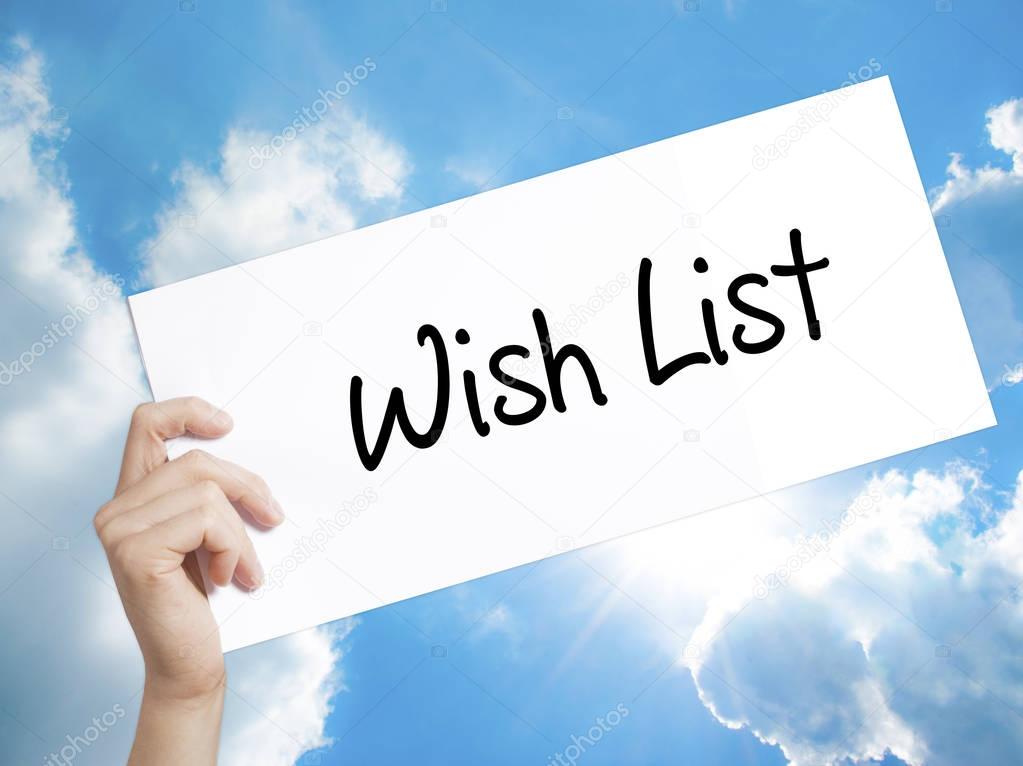 Wish List Sign on white paper. Man Hand Holding Paper with text.