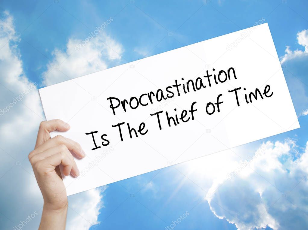  Procrastination Is The Thief of Time Sign on white paper. Man H