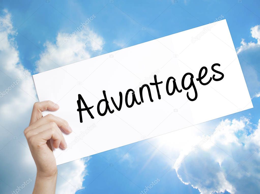 Advantages Sign on white paper. Man Hand Holding Paper with text