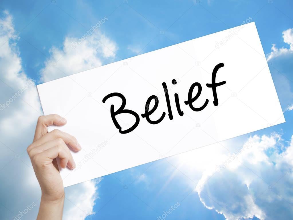Belief Sign on white paper. Man Hand Holding Paper with text. Is