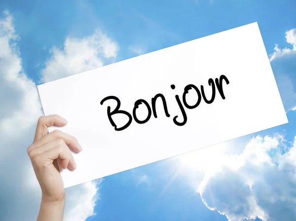 Bonjour (Buenos días en francés) Firma en papel blanco. Mano de hombre — Foto de Stock