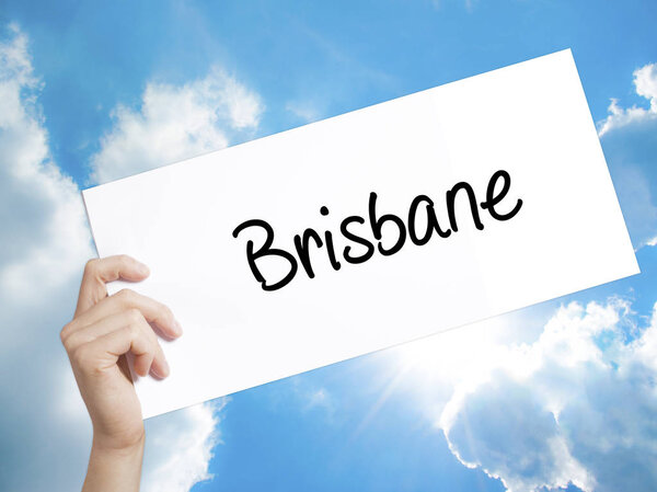 Brisbane  Sign on white paper. Man Hand Holding Paper with text.