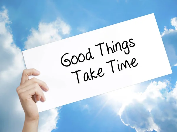 Good Things Take Time Firma en papel blanco. Hombre mano sosteniendo pape — Foto de Stock