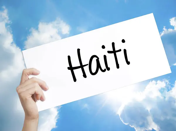 Haiti jel a fehér papíron. Az ember keze gazdaság papír szöveggel. ISO — Stock Fotó