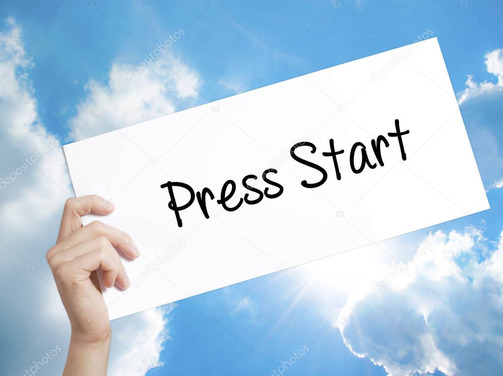 Press Start Sign on white paper. Man Hand Holding Paper with tex