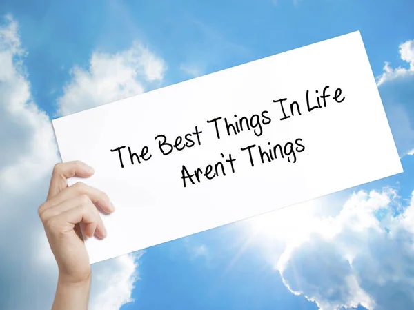 The Best Things In Life Aren't Things Sign on white paper. Man H