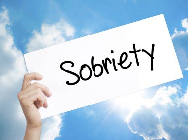Sobriety Sign on white paper. Man Hand Holding Paper with text.  clipart