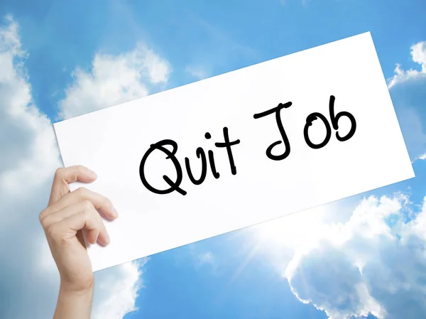 Quit Job Sign on white paper. Man Hand Holding Paper with text.