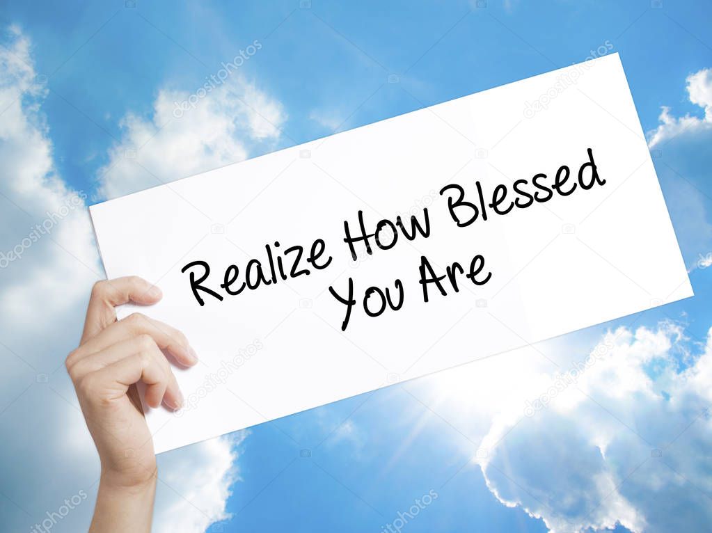  Realize How Blessed You Are  Sign on white paper. Man Hand Hold