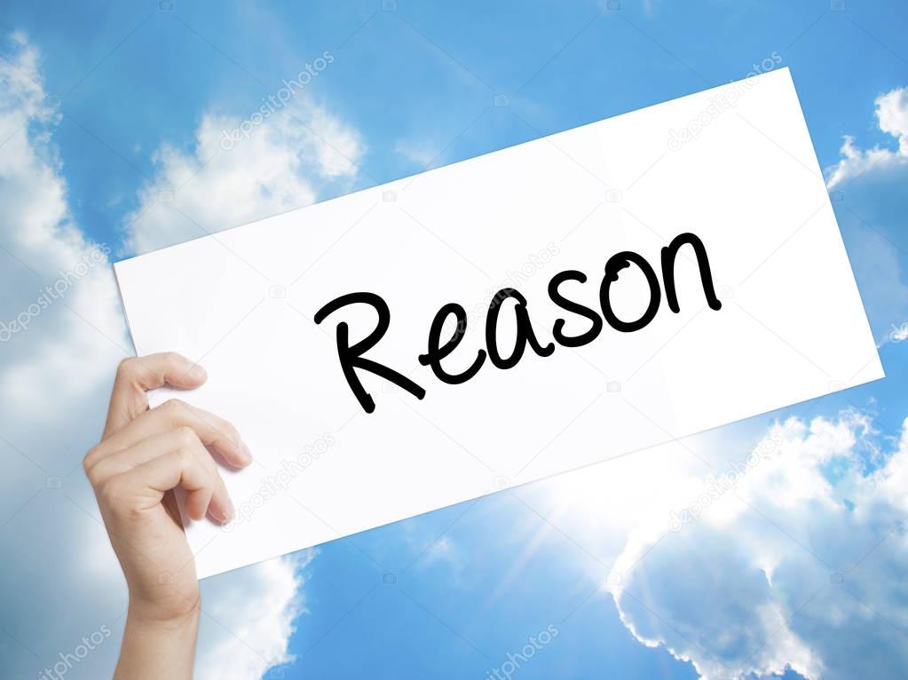 Reason Sign on white paper. Man Hand Holding Paper with text. Is