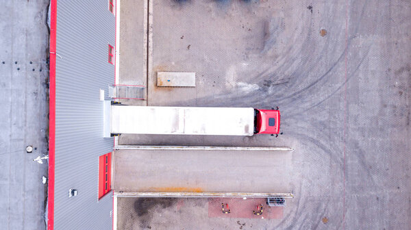 Aerial View of Loading Warehouse with Semi Truck. Aerial