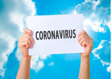 Coronavirus, beyaz ellerde Coronavirus yazısıyla uyarı işareti. Çin Coronavirüsü 2020, Wuhan virüsü, Çin Coronavirüs salgını gribi..