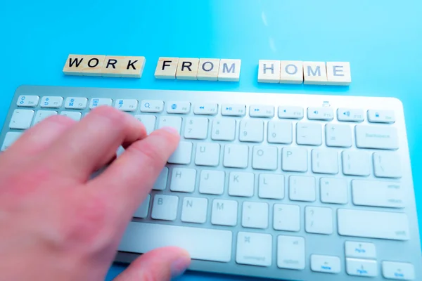 concept work from home 'Work From Home' written post it on laptop keyboard