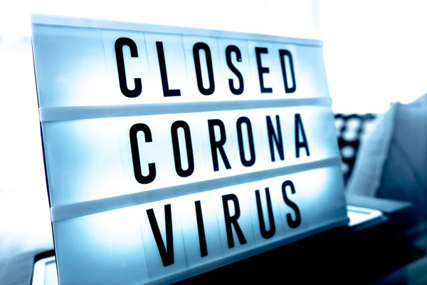 Closed businesses for CoronaVirus pandemic outbreak, closure sign on retail store window banner background. Government shutdown of restaurants, shopping stores, non essential services.