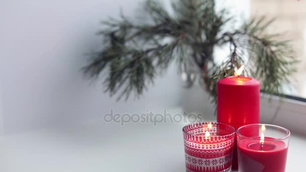 Candles on a windowsill. Christmas time — Stock Video