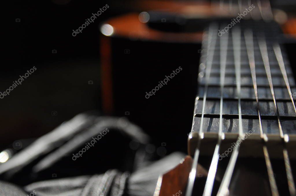 Classical guitar. Issuing a stringed instrument sounds. Fretboard