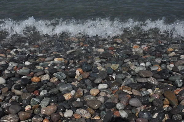 Black Sea. Waves washing down rocky beach in Georgia.