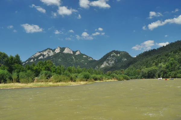 Bald mountain tops, Three Crowns in the Pieniny National Park in Poland. View from the Dunajec riverbed during rafting with rafts.