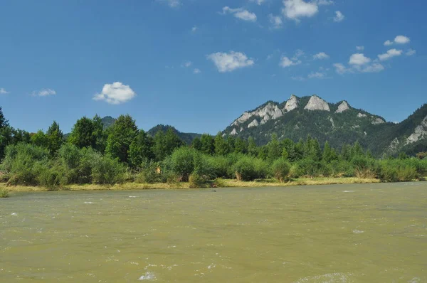 Bald mountain tops, Three Crowns in the Pieniny National Park in Poland. View from the Dunajec riverbed during rafting with rafts.