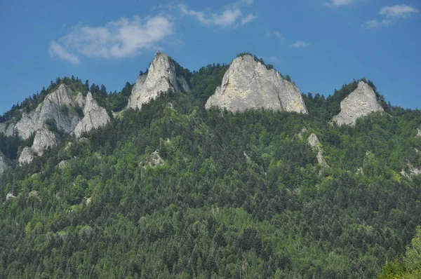 Bald mountain tops, Three Crowns in the Pieniny National Park in Poland. View from the Dunajec riverbed during rafting with rafts.