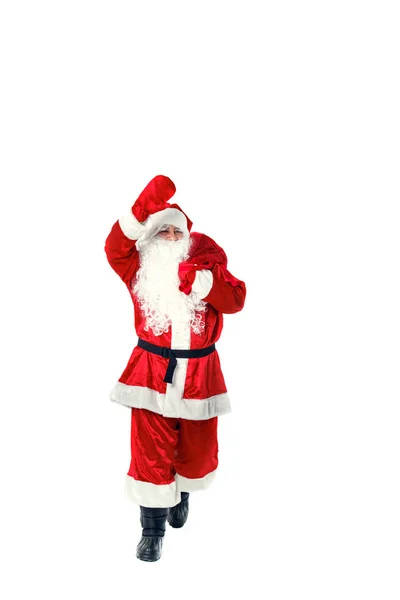 Santa Claus niesie ze sobą prezenty. — Zdjęcie stockowe