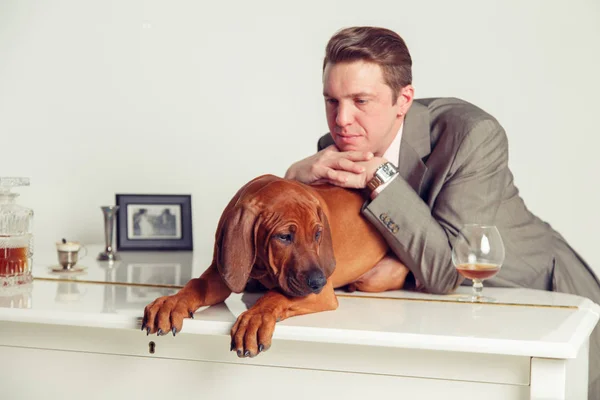 Successful businessman with his dog.