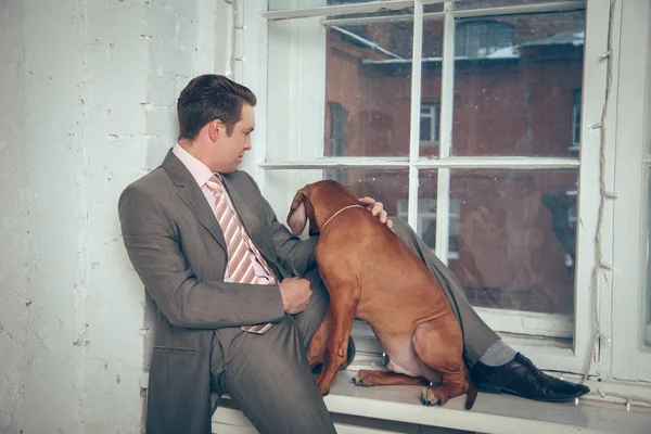 Successful businessman with his dog.