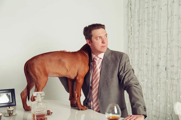 Successful businessman with his dog.