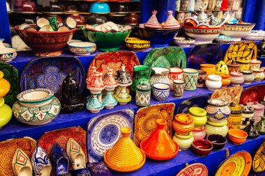 Decorative Tajines at a market in Marrakech. Moroccan design. Oriental souvenirs clipart