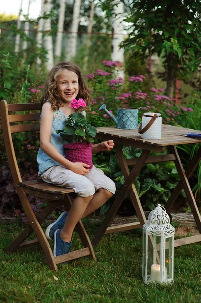 Happy Kid Girl Playing Summer Garden Holding Heranium Flower Pot — Stock Photo, Image
