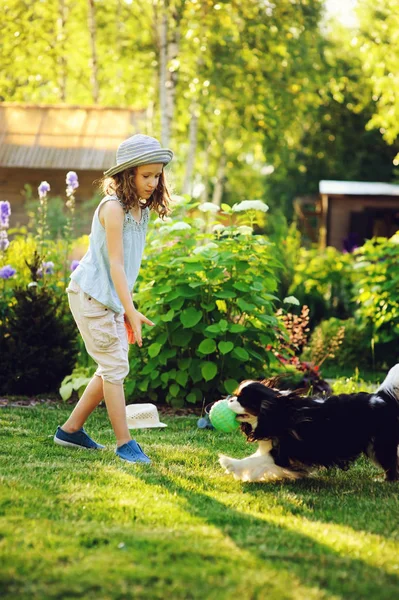 Happy Child Girl Playing Her Spaniel Dog Throwing Ball Enjoying — Stock Photo, Image