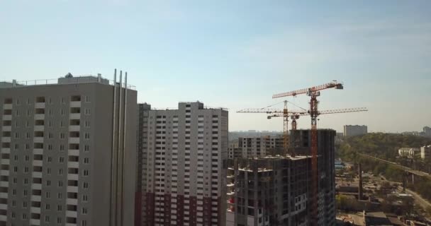 Drone Aerial view of high rise residential complex under construction. Building cranes building new apartment building construction. — Stock Video