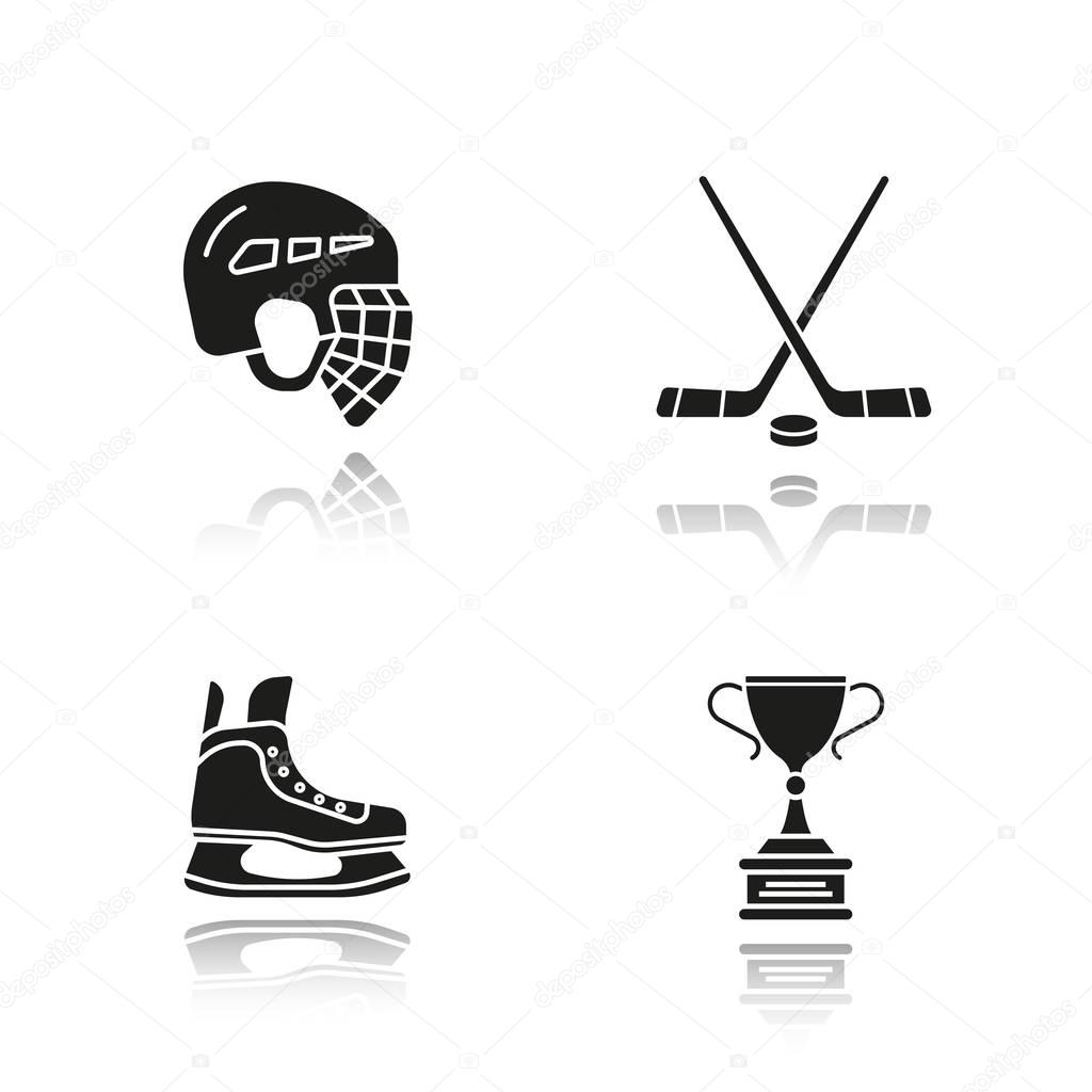 Hockey equipment drop shadow black icons set. Helmet, ice skate, sticks, winner's award. Isolated vector illustration