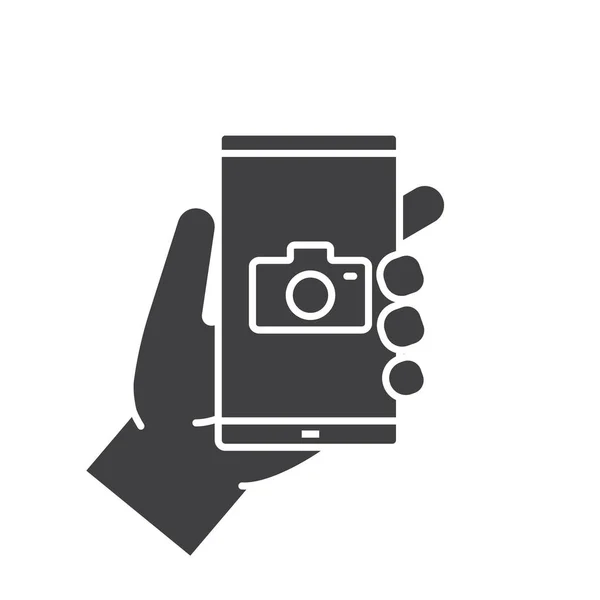 Hand holding smartphone icon — Stock Vector