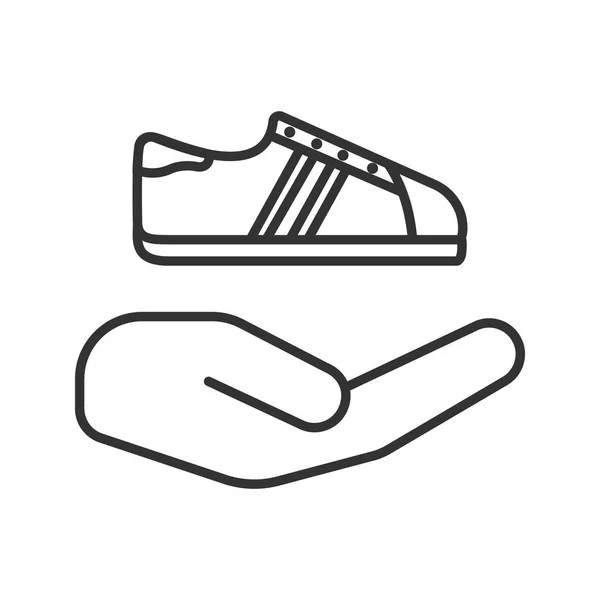 Открытая рука с значком кроссовки — стоковый вектор